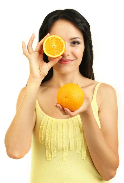 Girl with fresh oranges isolated on white - 写真・画像