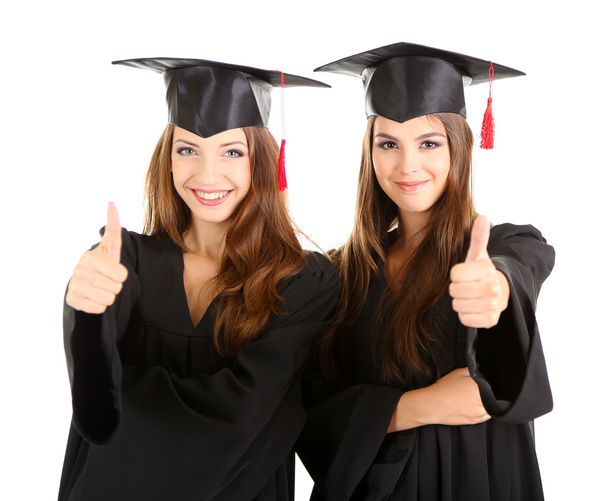Two happy graduating students isolated on white - 写真・画像