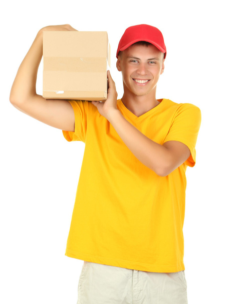 Young delivery man holding parcel, isolated on white - Foto, immagini