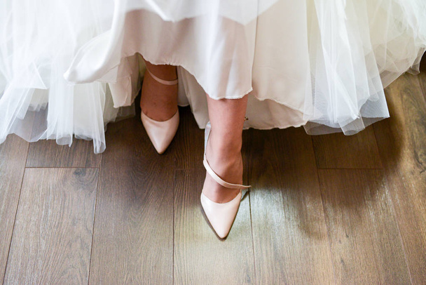  the bride is wearing shoes - Photo, image