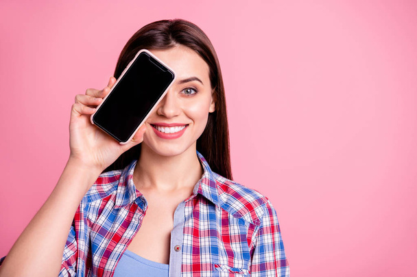 Close up photo of positive cheerful content attractive lady youth people hide cheeks hands finger good-looking use user device advertise ads wear plaid clothing isolated pastel background - Φωτογραφία, εικόνα