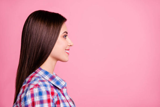 Close-up profile side view portrait of her she nice-looking attractive lovely pretty groomed content cheerful cheery straight-haired girl wearing checked shirt isolated over pink background - Foto, afbeelding