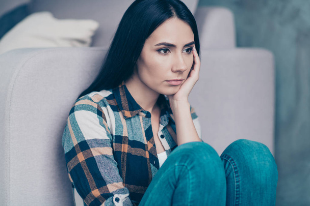 Close up side profile photo beautiful she her lady arm hold lean head displeased hopeless suffer break up boyfriend look like zombie wear checkered plaid shirt sit floor lean divan house room indoors - Photo, Image