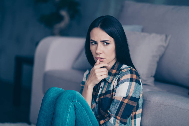 Close up side profile photo beautiful she her lady displeased hopeless arm hand palm mouth nerves made mistake doubts wear checkered plaid shirt sit floor lean divan flat house living room indoors - Photo, Image