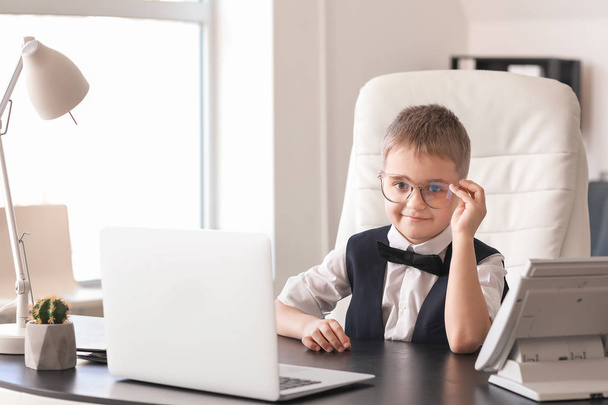 Cute little businessman in office - Photo, Image