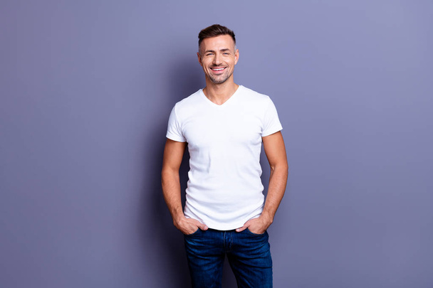 Close up photo amazing he him his middle age macho perfect appearance easy-going reliable person show white teeth bristle wear casual jeans denim pants trousers white t-shirt isolated grey background - Photo, Image