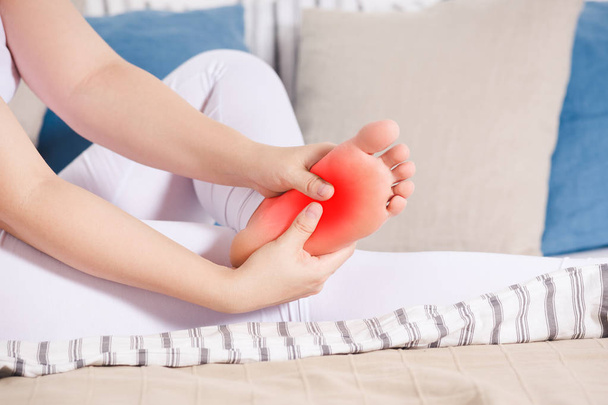 Woman's leg hurts, pain in the foot, massage of female feet - Foto, Bild
