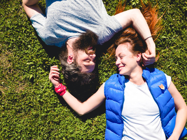 Couple on the grass in the park - Foto, imagen
