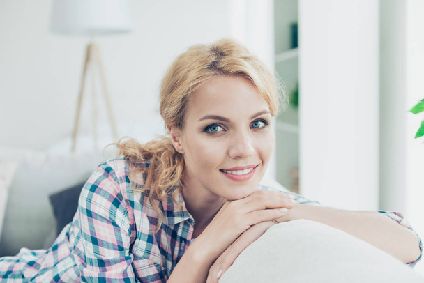 Close-up portrait of her she nice-looking attractive lovely sweet charming cute amazed ecstatic cheerful cheery positive wavy-haired girl wearing checked shirt having rest at white light style - Foto, imagen