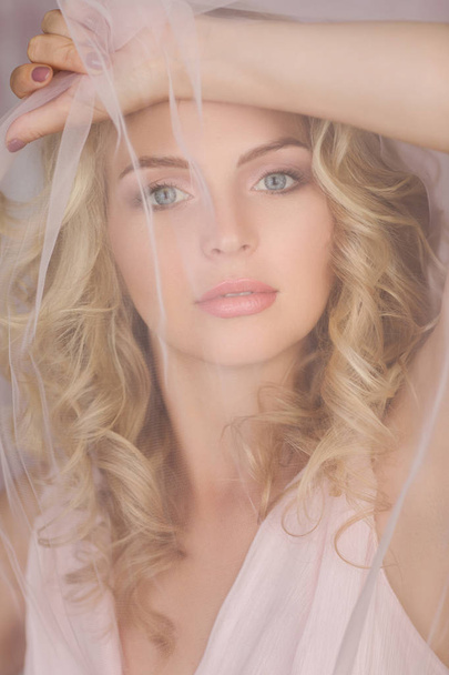 curly blonde woman in gorgeous pink dress - Foto, Imagem