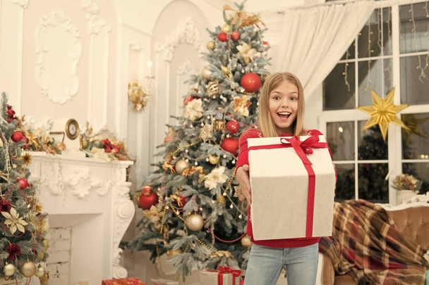 Child enjoy the holiday. Happy new year. Winter. xmas online shopping. Family holiday. Christmas tree and presents. The morning before Xmas. Little girl. Magic moment - Foto, imagen