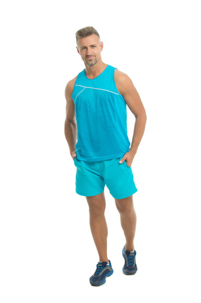 Mature but still young. Guy sport outfit. Fashion concept. Man model clothes shop. Sport style. Menswear and fashionable clothing. Man posing confidently white background. Sport maintain healthy body - Valokuva, kuva
