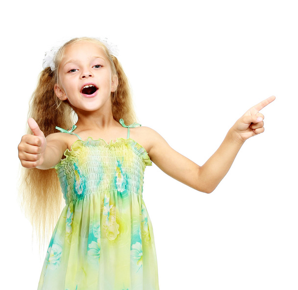 On a white background little girl points a finger - Zdjęcie, obraz