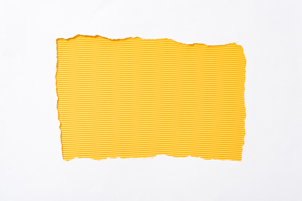 striped yellow colorful background in white torn paper hole - Photo, Image