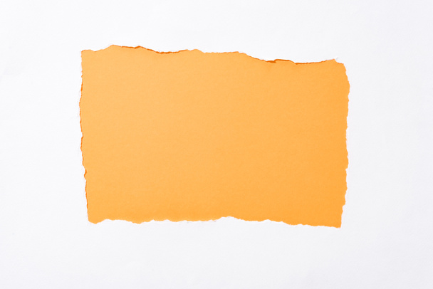 orange colorful background in white torn paper hole - Foto, imagen