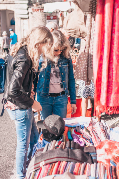 Gordes, Vaucluse/France - September 25, 2018: Attractive fashionable cute blonde in the market - 写真・画像