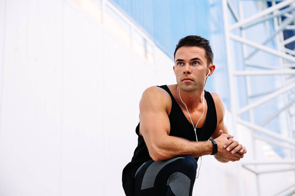 Strong sportsman preparing to workout, outdoors. - Foto, Imagem