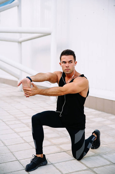 Muscular sportsman working out outdoors - Fotó, kép