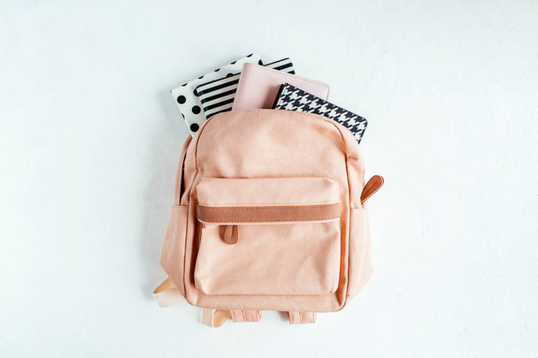 Backpack with school supplies and books for study - Фото, зображення
