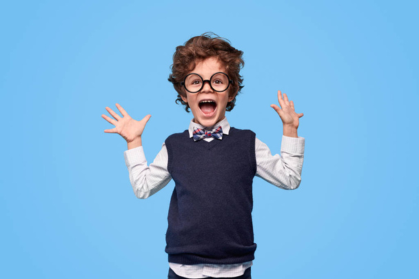 Excited schoolboy screaming and gesturing with hands - Φωτογραφία, εικόνα
