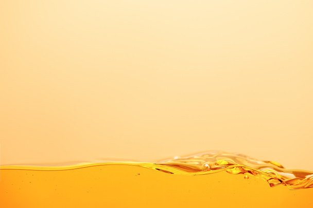 smooth yellow bright liquid isolated on yellow - Фото, зображення
