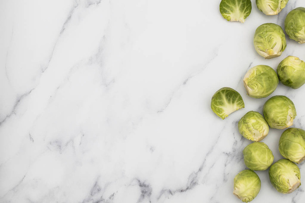 Fresh raw brussel sprouts on a marble background - Photo, Image