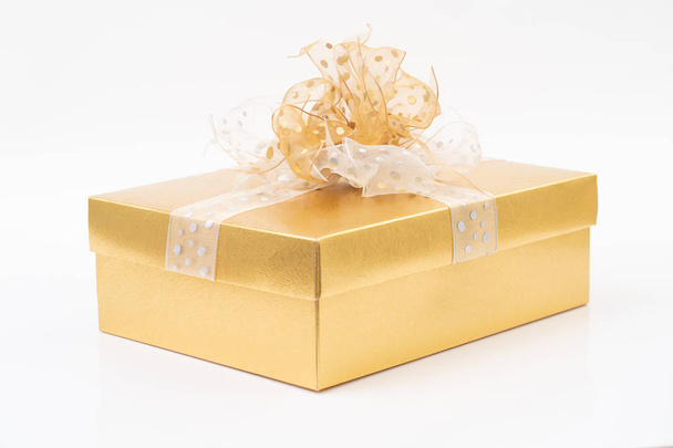 Gold gift box on white background - Photo, image