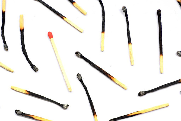 closeup view of many burnt matches over white background - Photo, Image