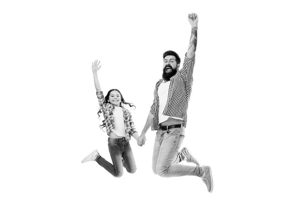 Behind every great daughter is a truly amazing dad. Happy father and little daughter jumping with joy. Bearded man and small daughter child smiling and holding hands. Treating his daughter with love - Fotoğraf, Görsel