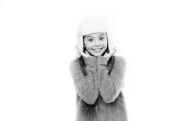 Kid girl wear hat with ear flaps white background. Soft furry accessory. Tips for caring for fur garments. Child long hair soft hat enjoy softness. Winter fashion concept. Warm hat for cold weather - Foto, immagini