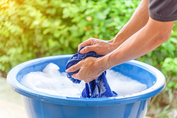 hand washing clothes in Blue basin - Zdjęcie, obraz