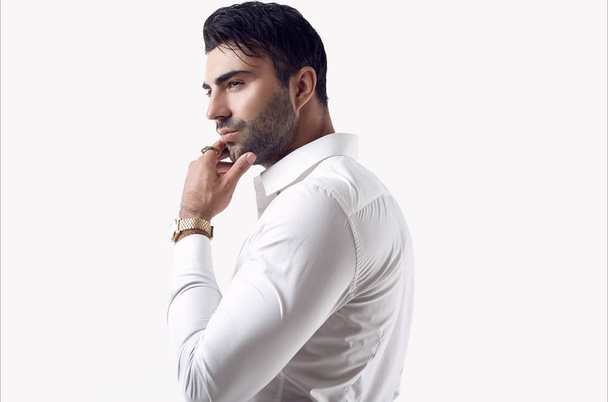 Beautiful brutal tanned businessman in a white shirt and sunglasses - Photo, image
