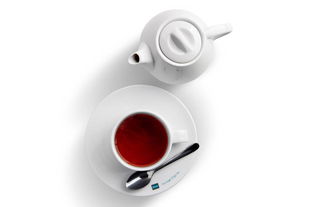 July 25, 2019, Minsk, Belarus - Ceramic tea cup and pot with Dilmah tea isolated on white - Valokuva, kuva