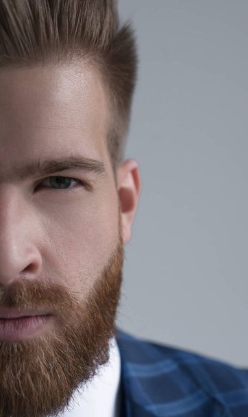 half portrait of stylish handsome bearded businessman looking at camera isolated on grey - Fotoğraf, Görsel