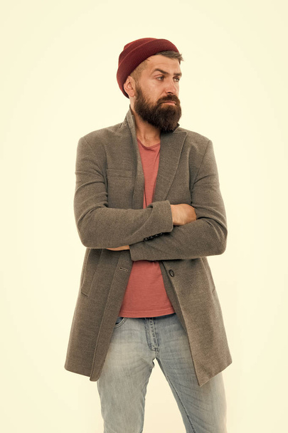 Menswear and fashion concept. Man bearded hipster stylish fashionable coat and hat. Stylish outfit hat accessory. Pick matching clothes. Find outfit style you feel comfortable. Stylish casual outfit - Zdjęcie, obraz