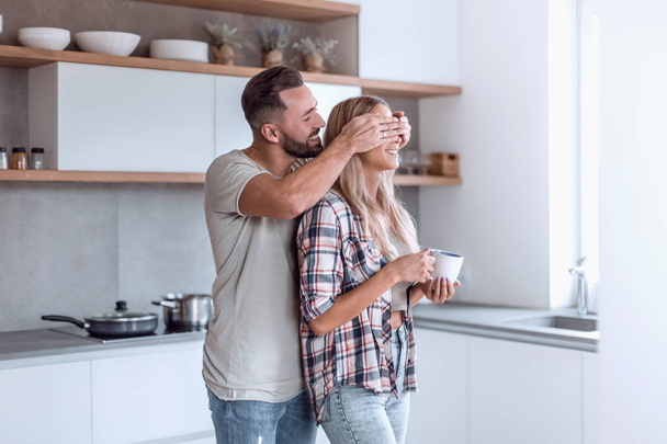 cheerful couple in the kitchen on a good morning - Fotoğraf, Görsel