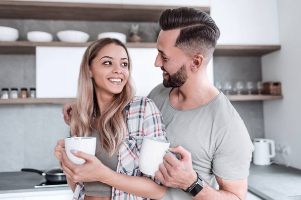 happy young couple in kitchen in good morning time - Foto, Imagem