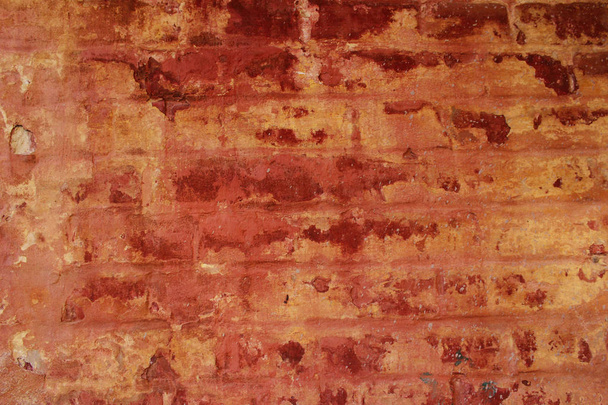 Immagine sfocata di una vecchia texture muraria in mattoni dipinti. Sfondo texture astratta. Vecchio sfondo della parete con un sacco di spazio di copia per il testo
. - Foto, immagini