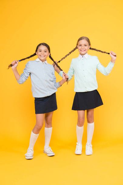 School friendship. Support and friendship. Problem relations. Friendly relationship. Friendship goals. Cute school girls classmates. First school day. Sisterhood and friendship. Cheerful mood concept - Photo, Image