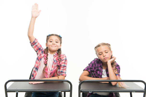 Students classmates sit desk. Back to school. Private school concept. Elementary school education. Little girls school friends study together. Raise hands to answer. Enjoy process of studying - Foto, Bild
