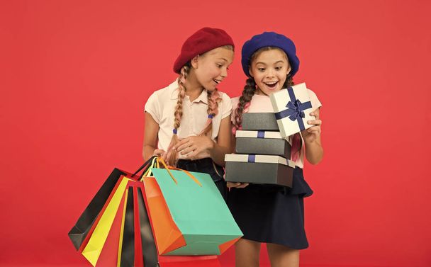 Shopping and holidays. For my dear friend. Girl giving gift box to friend. Girls friends celebrate holiday. Children formal wear with gift box. Open gift now. Friendship concept. Birthday present - Fotoğraf, Görsel