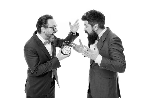 time management. mature bearded men in formal suit hold alarm clock. deadline. late again. angry businessmen. bad morning. a lot of work. Time is money. watching the time. checking the time - Foto, immagini