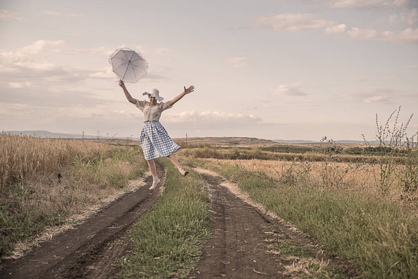 Girl  in a field of wheat - Фото, зображення