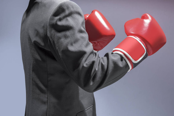 Businessman with red boxing gloves - Foto, imagen