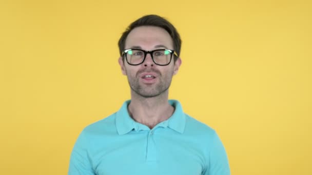 Flying Kiss by Young Man Isolated on Yellow Background - Video, Çekim