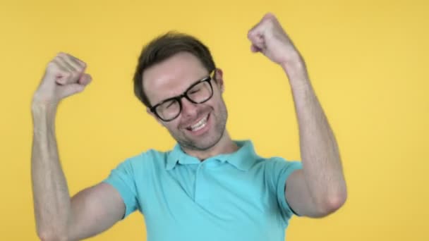 Happy Young Man Dancing Isolated on Yellow Background - Πλάνα, βίντεο