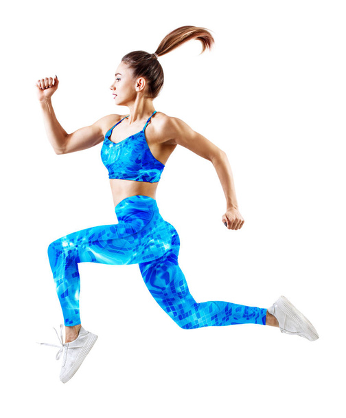 Молода жінка бігун в блакитному спортивному одязі стрибає в повітрі
. - Фото, зображення