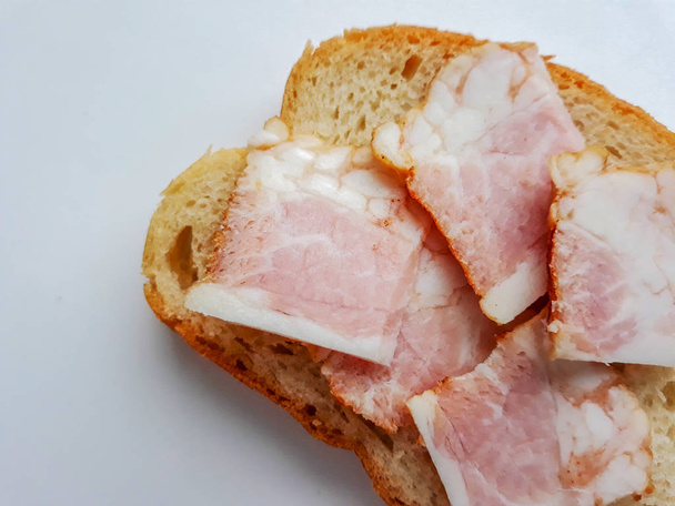 Sliced pork lard. Sliced bacon. Fat, tallow, grease, bacon. - Photo, Image
