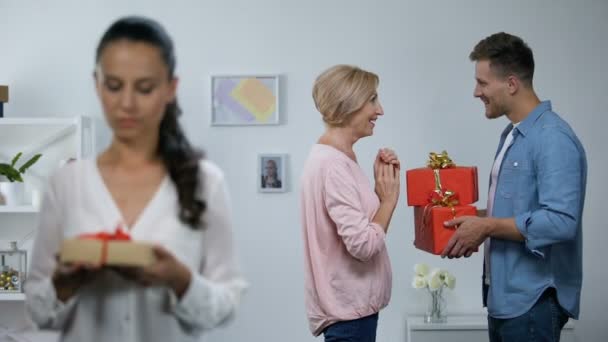 Wife holding small gift box wife husband giving mother big presents, attention - Záběry, video