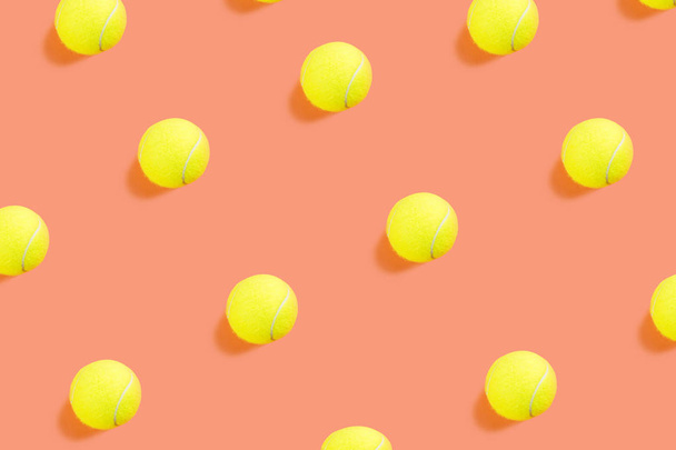 Tennis ball pattern on orange coral - Photo, Image